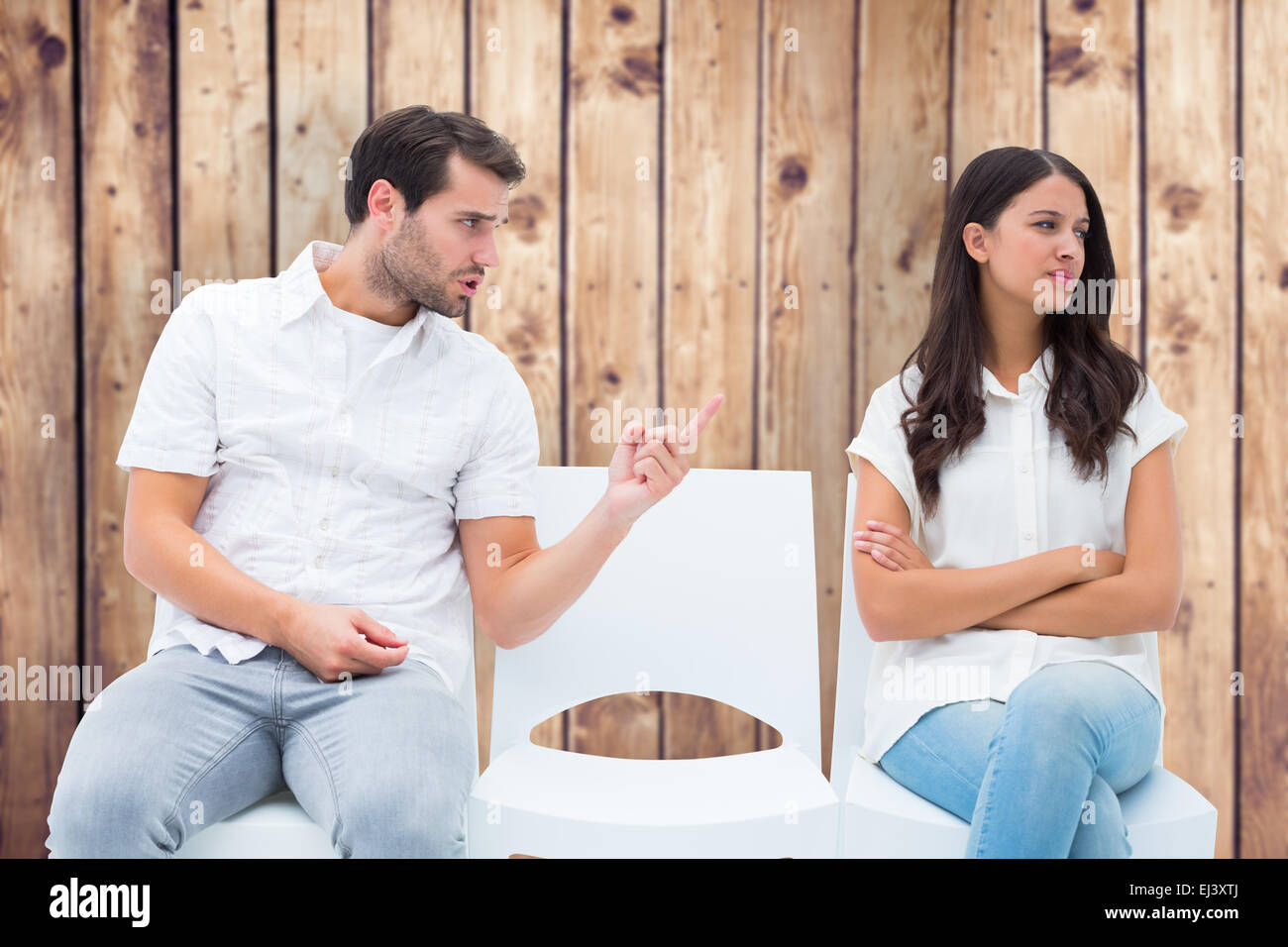 Composite image of man pleading with angry girlfriend Stock Photo