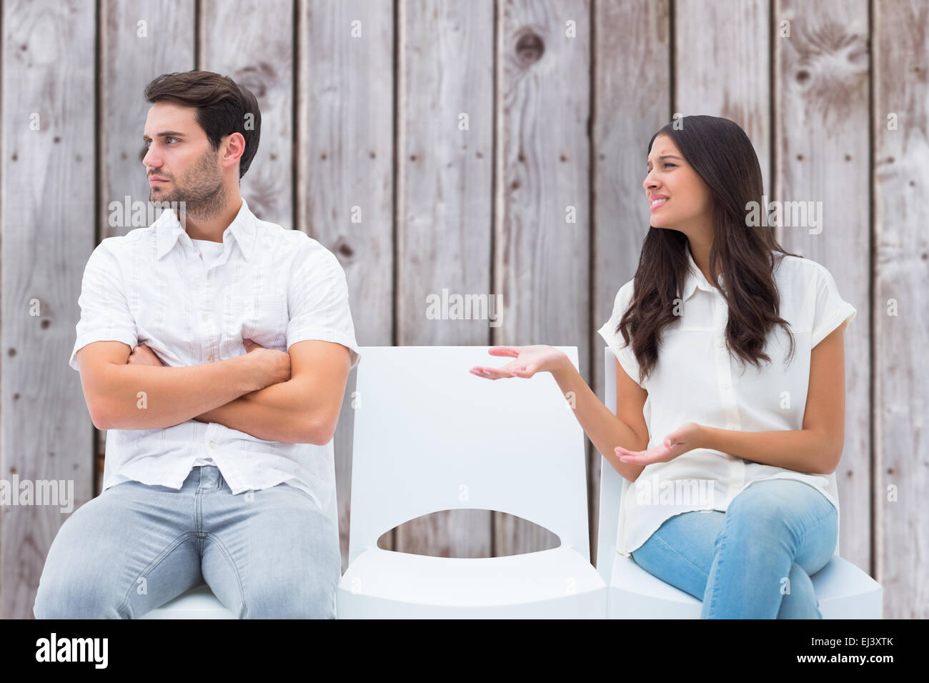 Composite image of brunette pleading with angry boyfriend Stock Photo