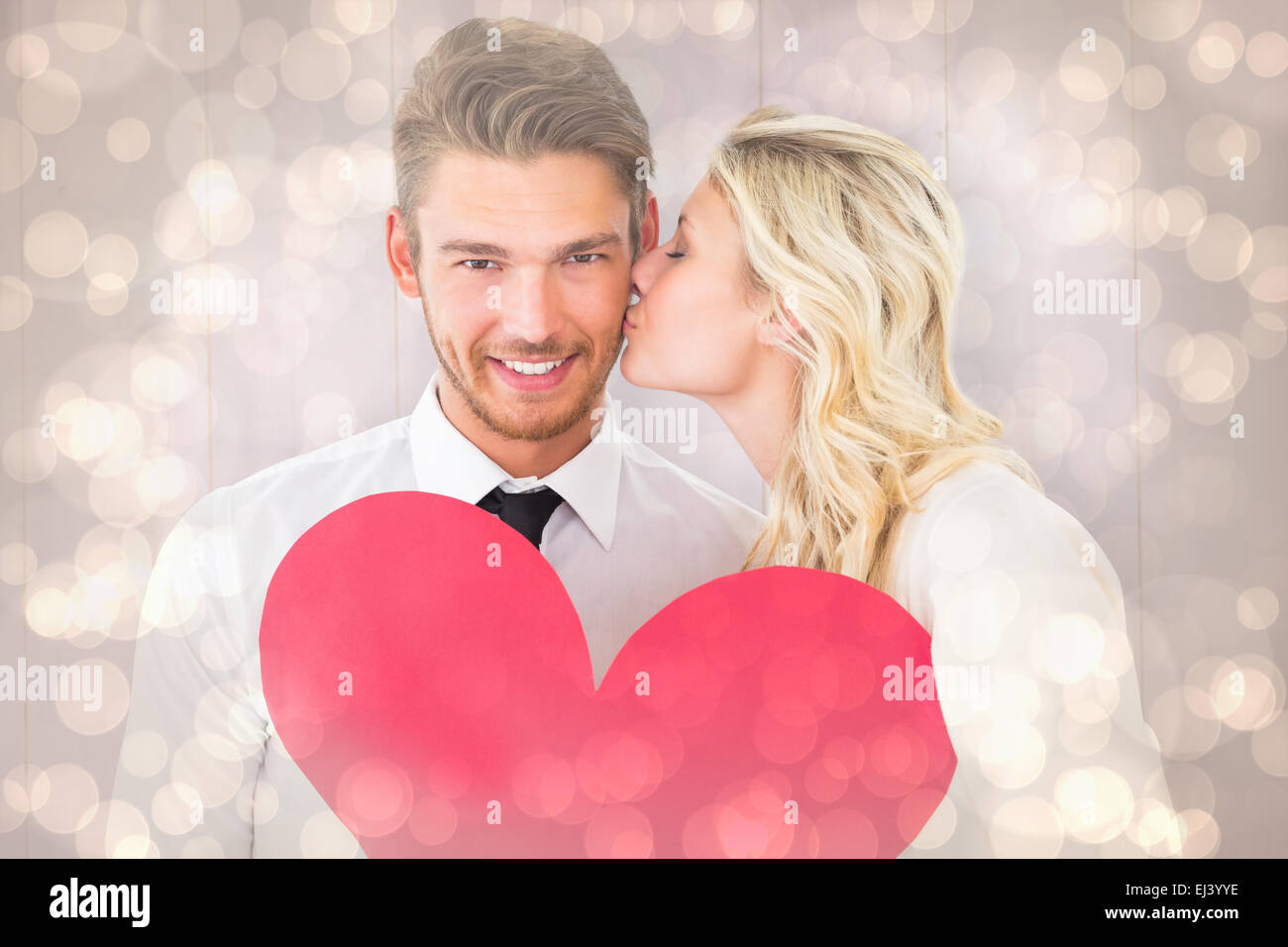 Composite image of attractive young couple holding red heart Stock ...