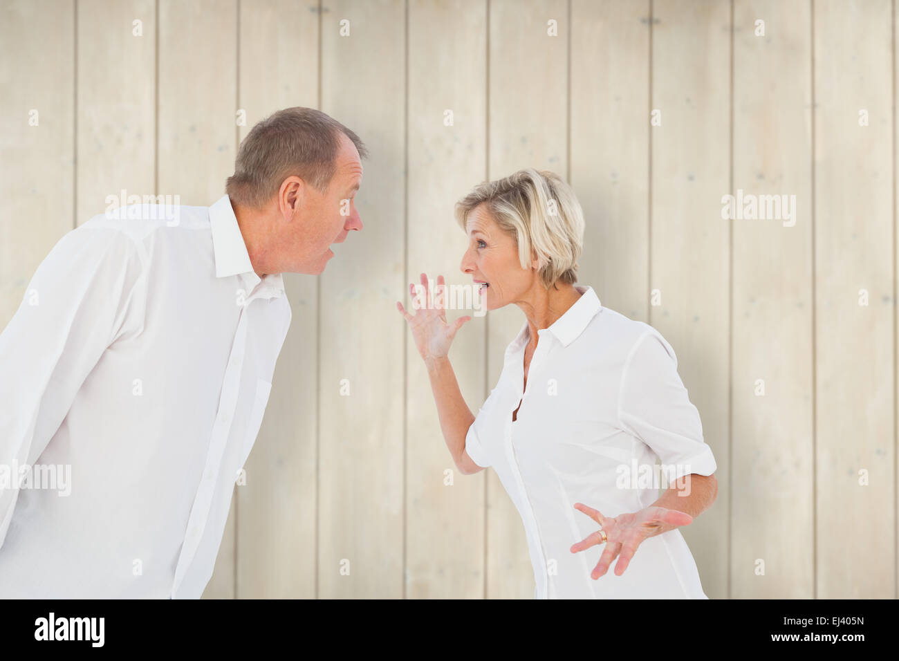 Composite image of angry older couple arguing with each other Stock Photo