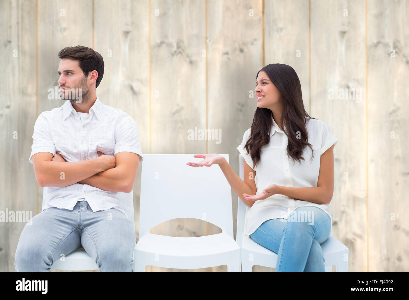 Composite image of brunette pleading with angry boyfriend Stock Photo