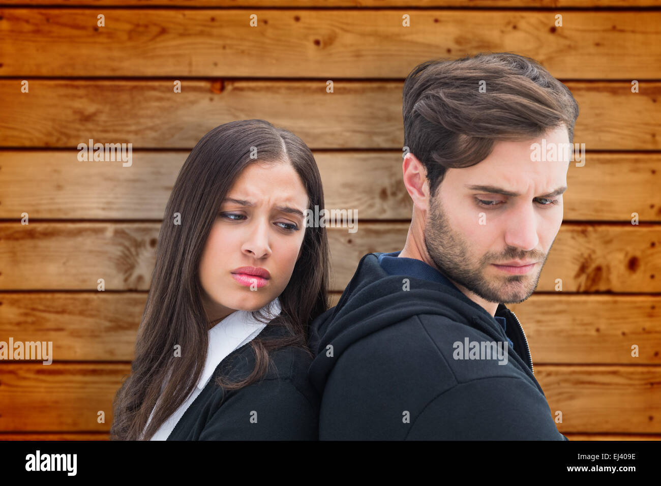 Composite image of unhappy couple not speaking to each other Stock Photo