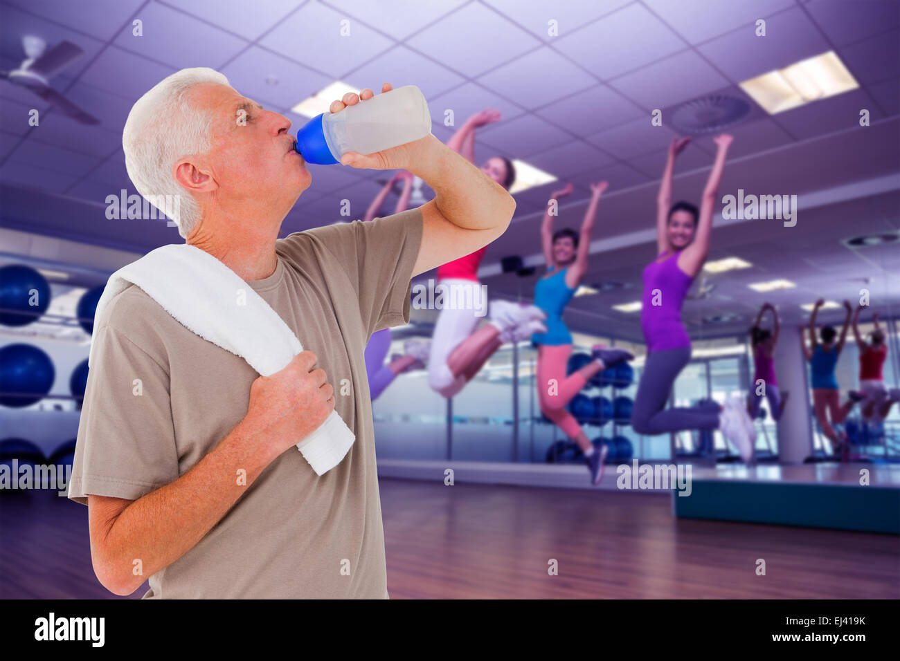 Senior man drinking from water bottle Stock Photo Alamy