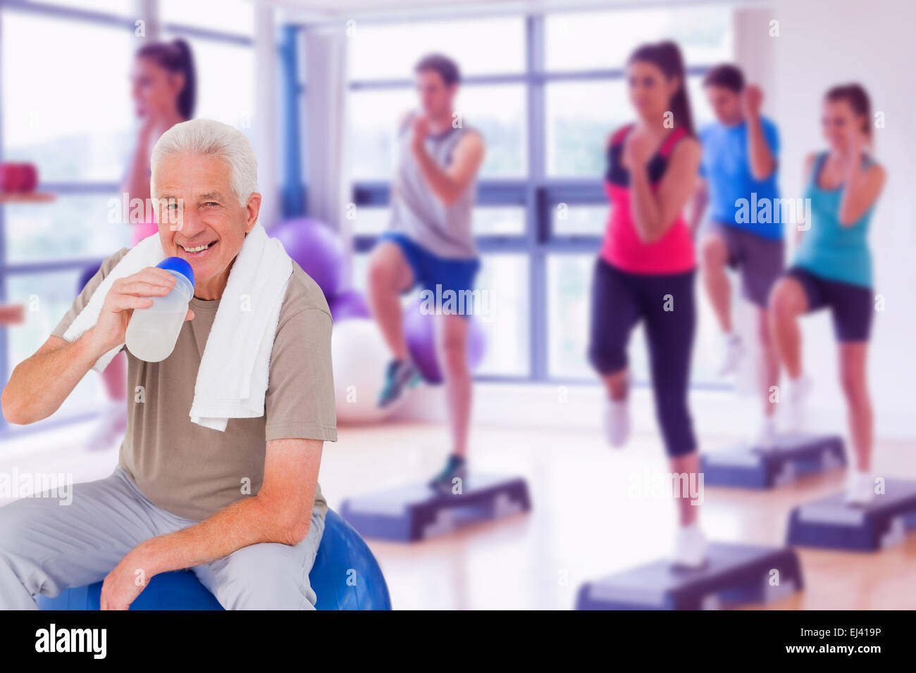 Senior man drinking from water bottle Stock Photo - Alamy