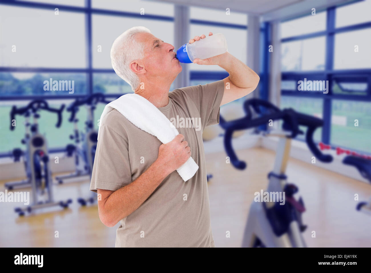 Composite image of senior man drinking from water bottle Stock Photo ...