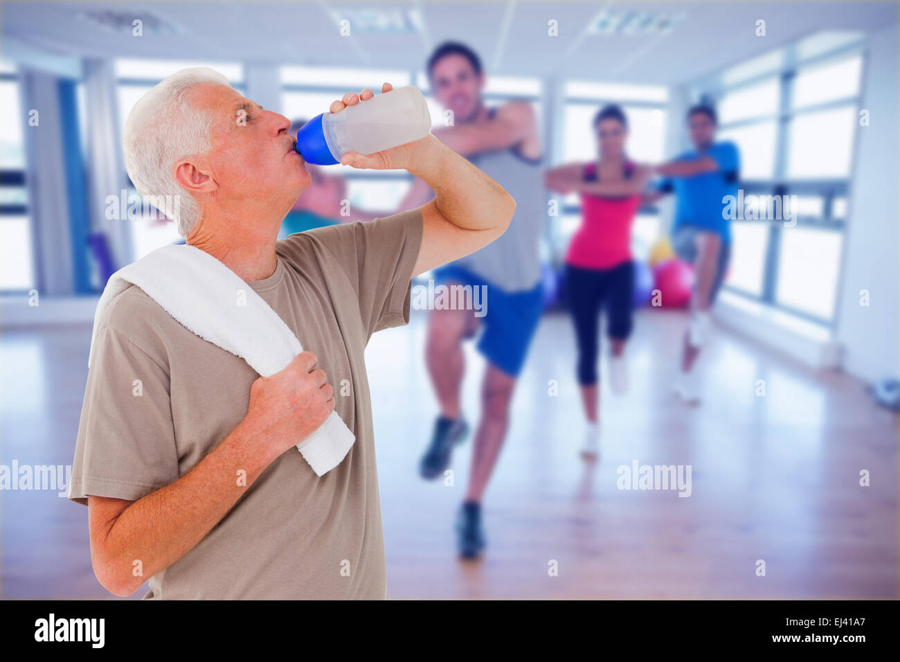 Senior man drinking from water bottle Stock Photo - Alamy