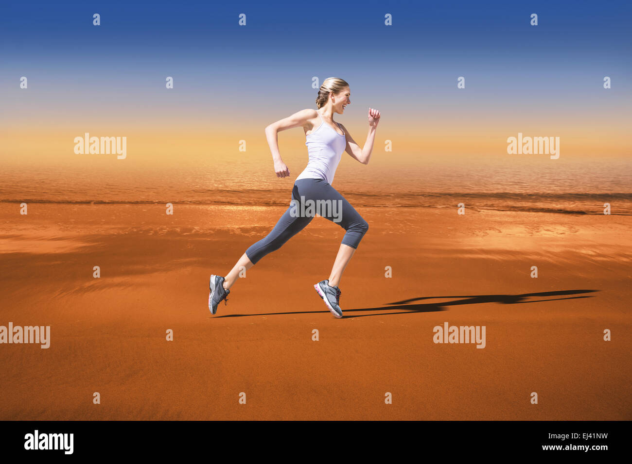 Composite image of pretty fit blonde jogging Stock Photo