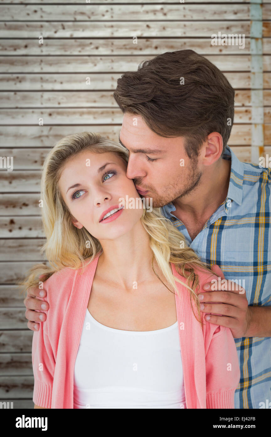 Composite image of attractive young couple smiling together Stock Photo ...