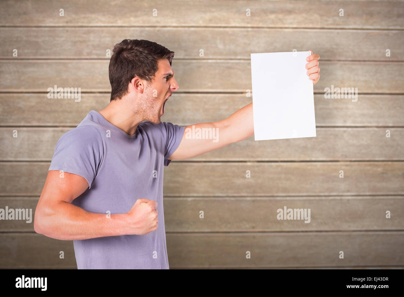 Composite image of angry man shouting at piece of paper Stock Photo