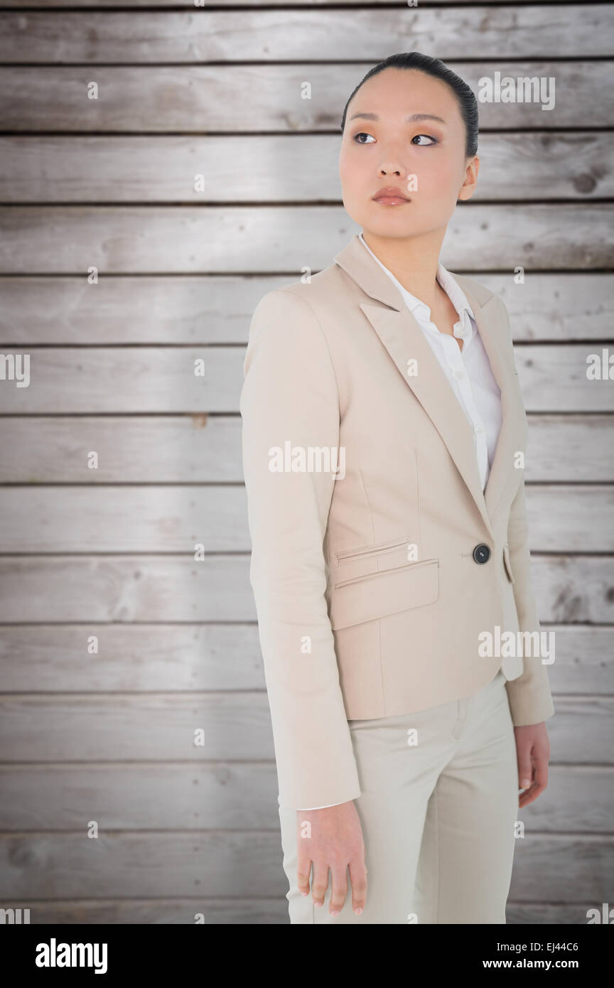 Composite image of unsmiling asian businesswoman Stock Photo