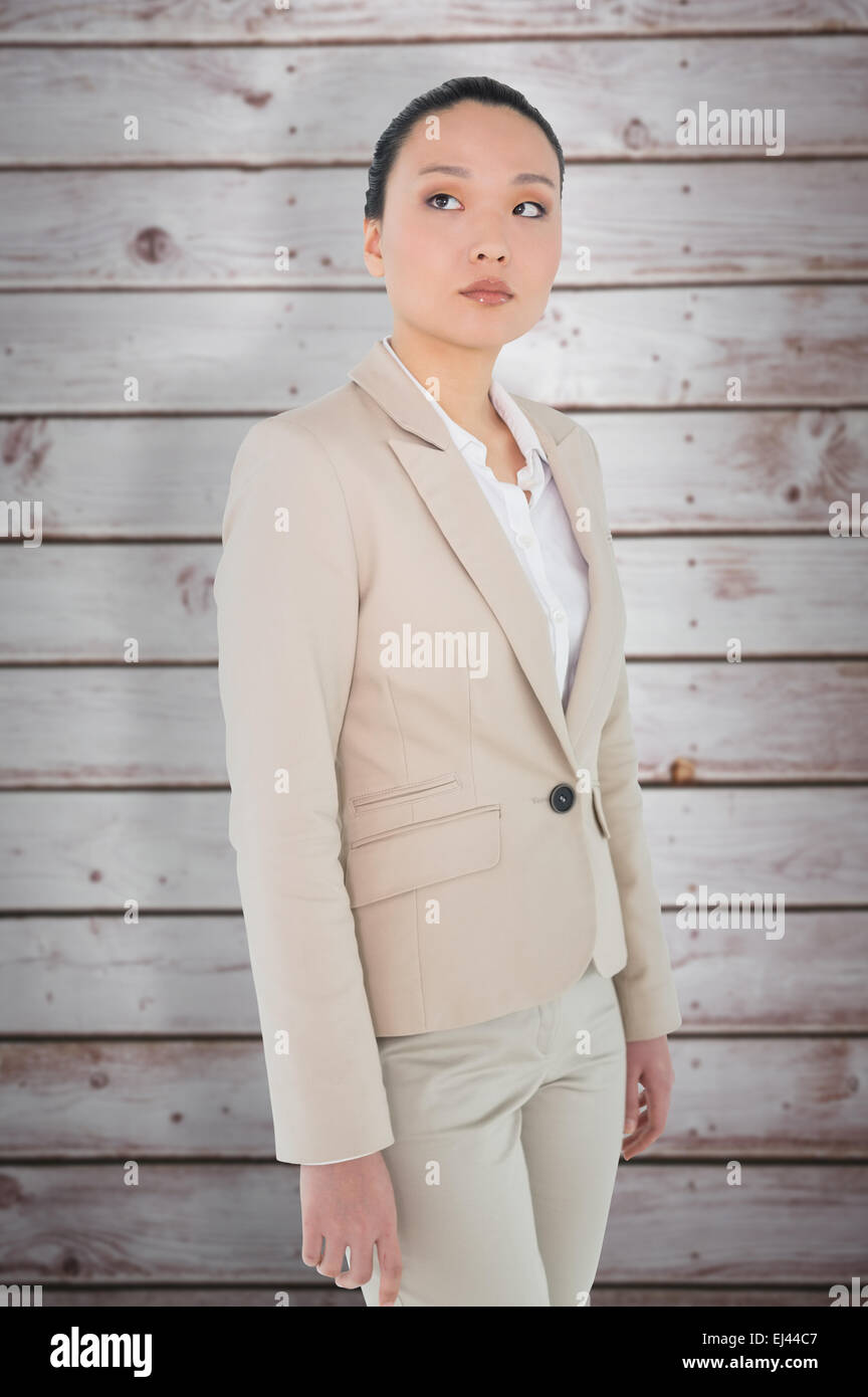 Composite image of unsmiling asian businesswoman Stock Photo