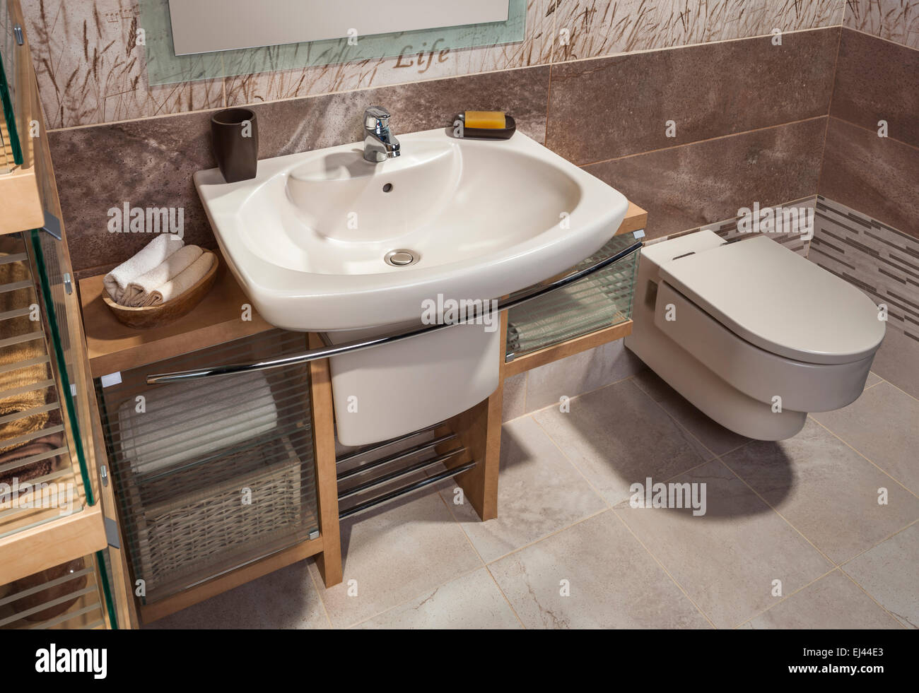 detail of a modern bathroom with sink, toilet and cabinet Stock Photo