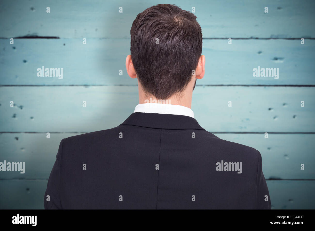 Composite image of rear view of businessman in suit standing Stock ...