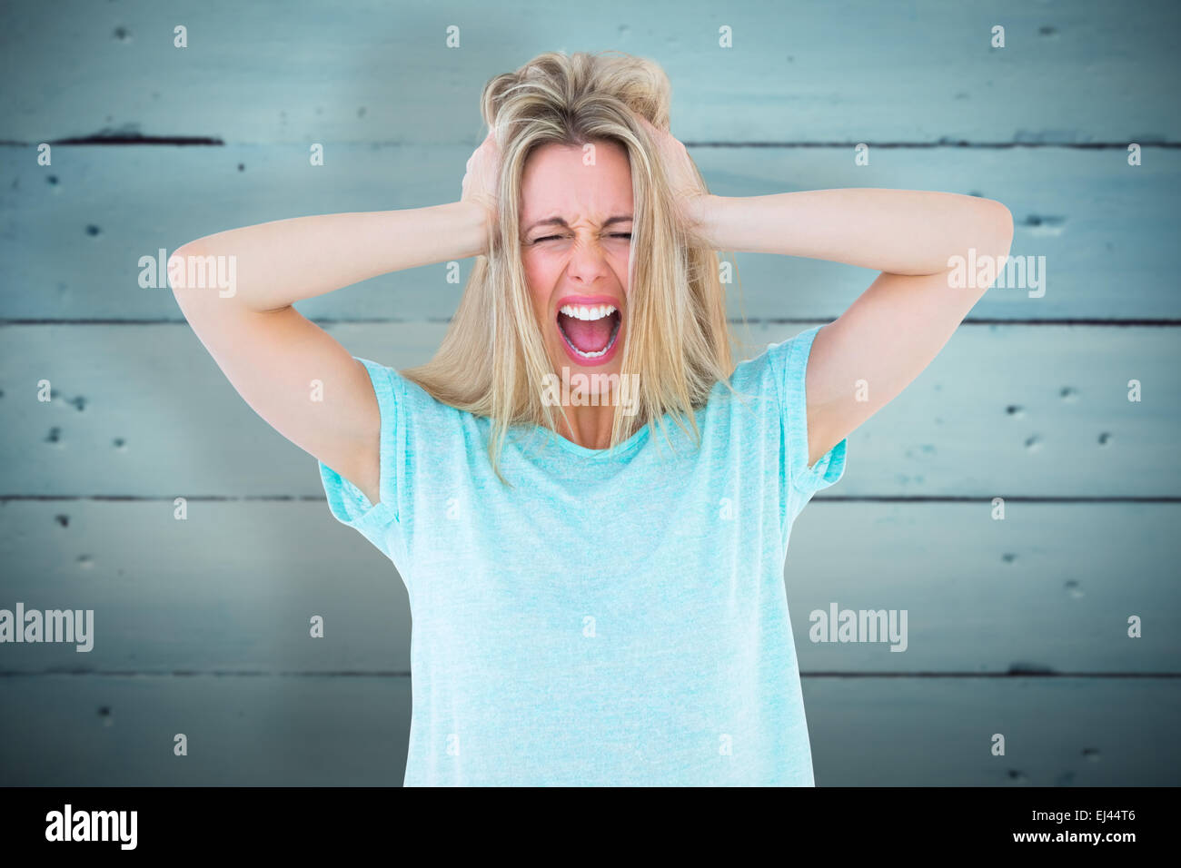 Composite image of furious blonde standing and yelling Stock Photo