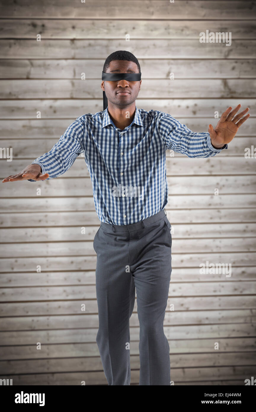 Blindfolded man standing in front of bull's eye Stock Photo - Alamy