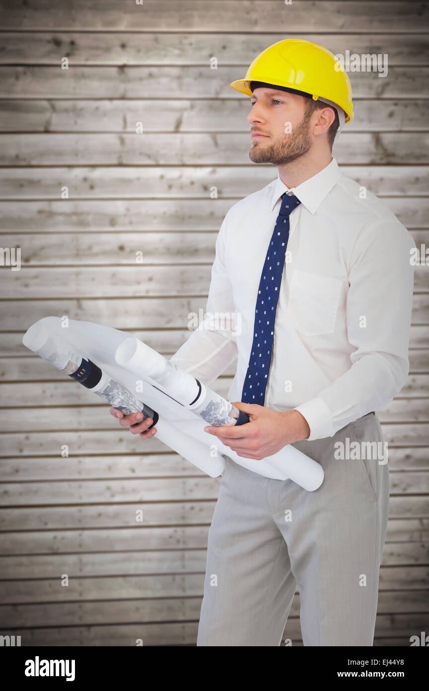 Composite image of thoughtful young architect posing Stock Photo