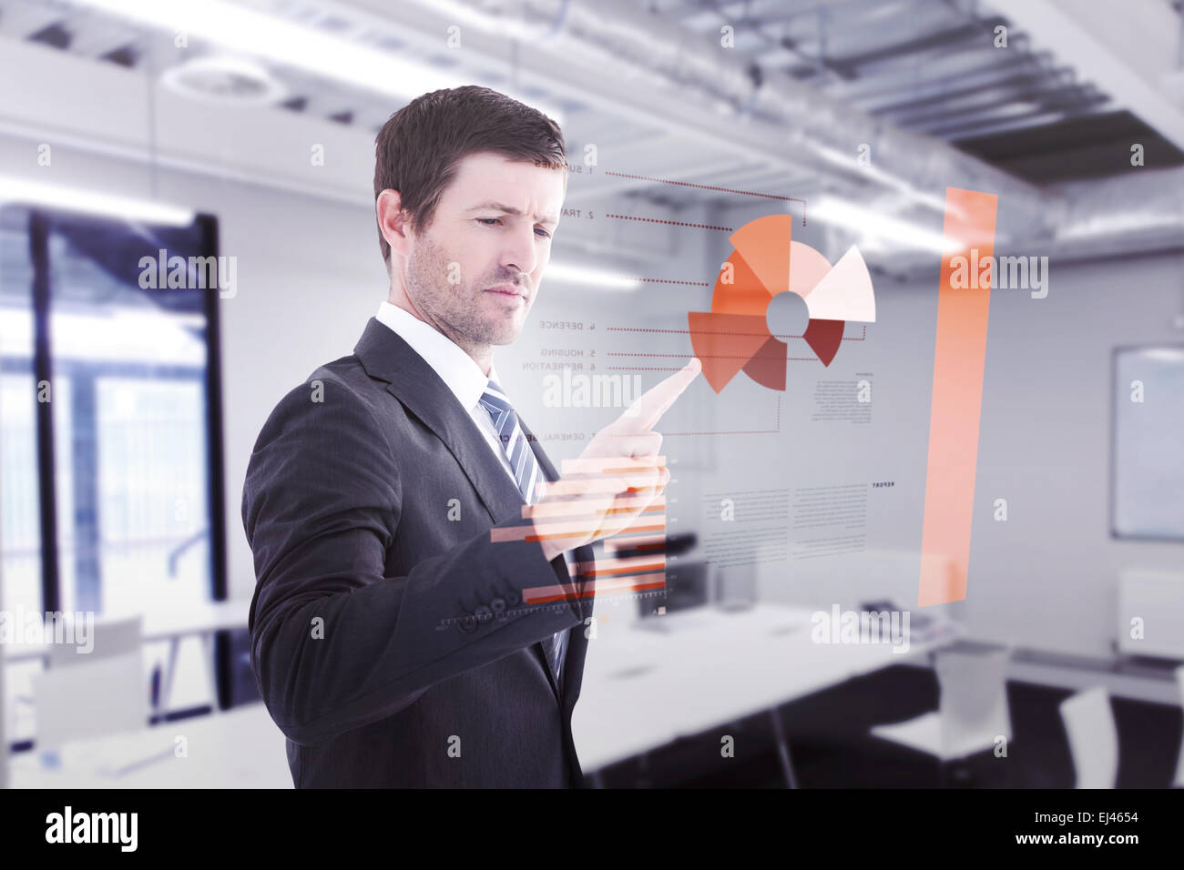 Composite image of businessman standing and pointing the finger Stock Photo