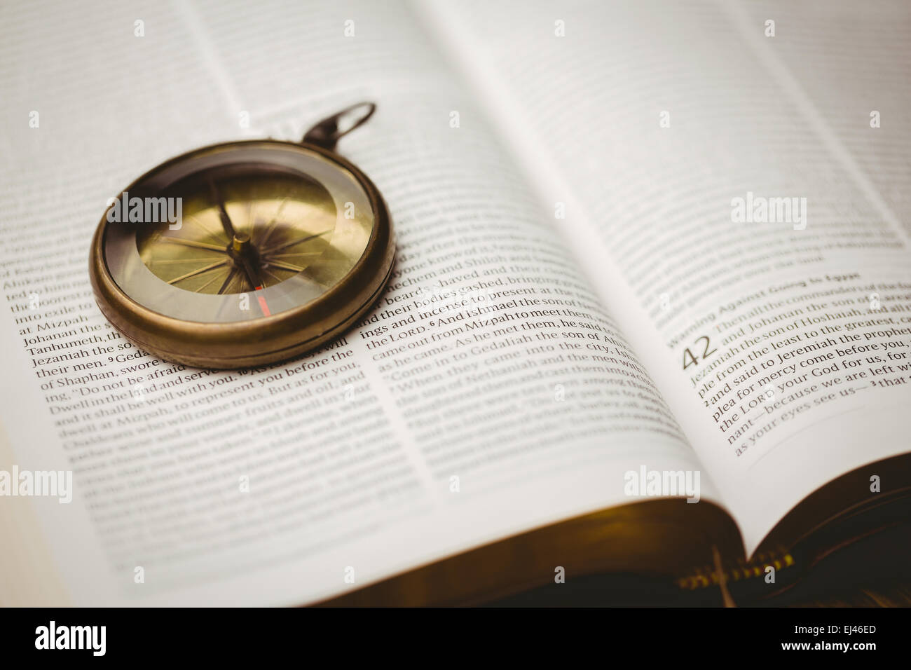 Compass on open bible Stock Photo Alamy