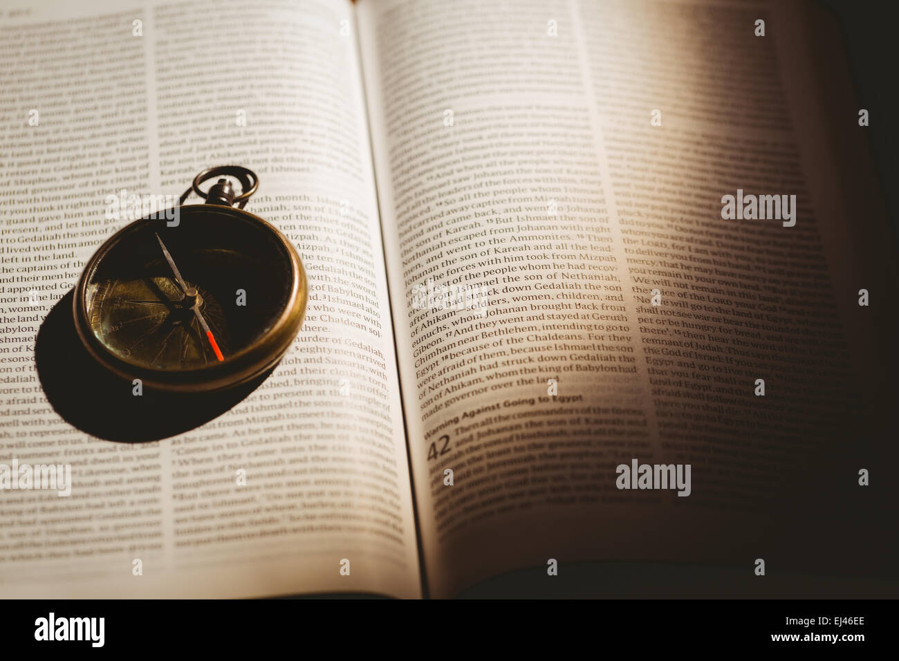 Compass On Open Bible Stock Photo - Alamy