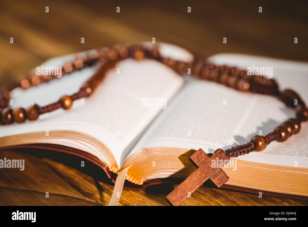 Open Bible With Rosary Beads Stock Photo - Alamy