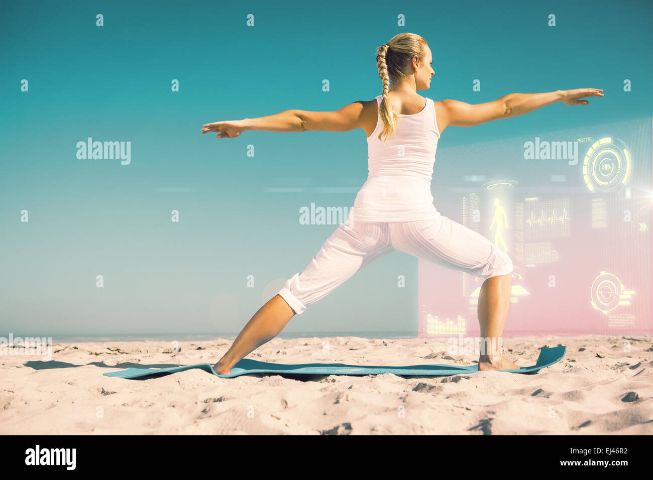 Composite image of calm woman standing in warrior pose on beach Stock ...