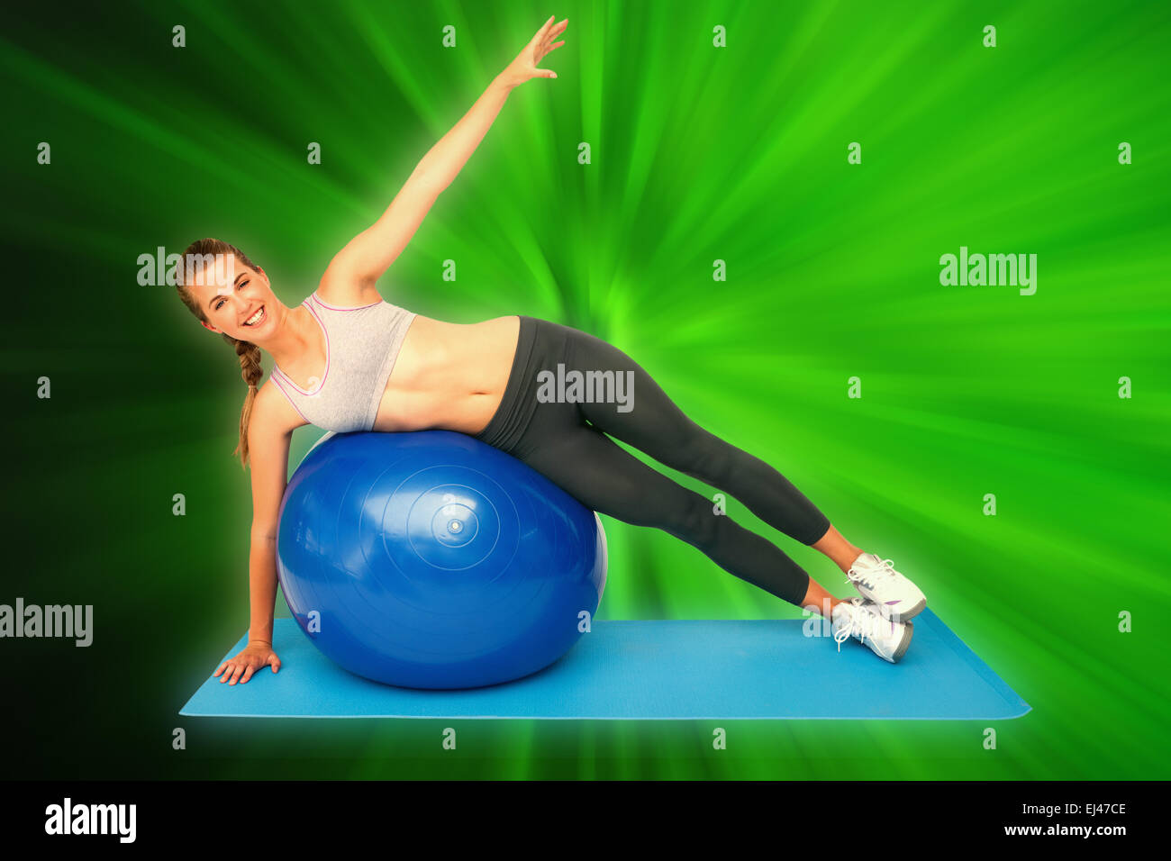 Composite image of portrait of a fit woman stretching on fitness ball ...