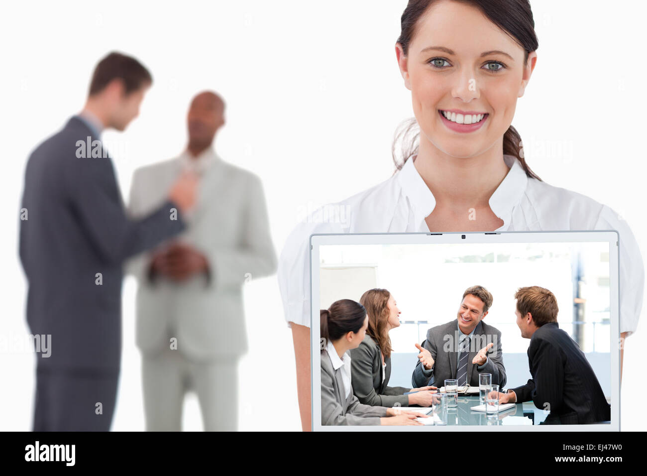 Composite image of happy team laughing together at a meeting Stock Photo