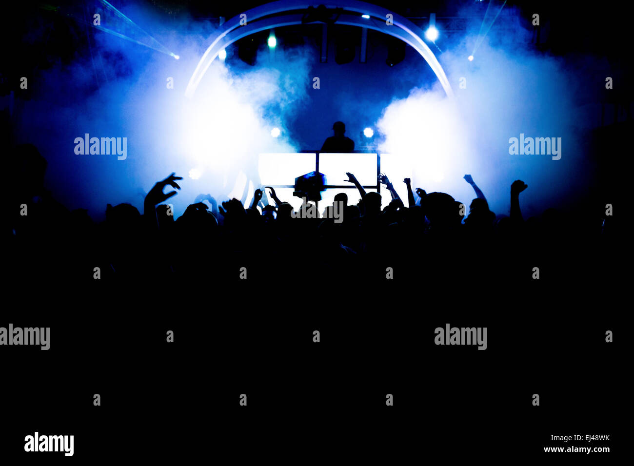 four silhouettes of a crowd on a party Stock Photo