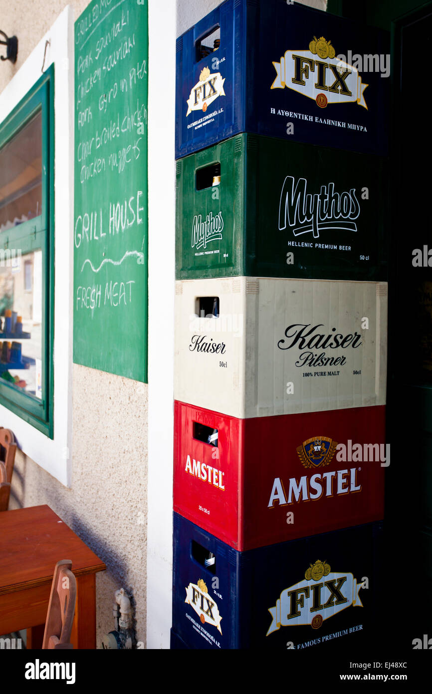 Beer cases stacked up outside a Bar in Eressos in Lesbos, Greece. Stock Photo