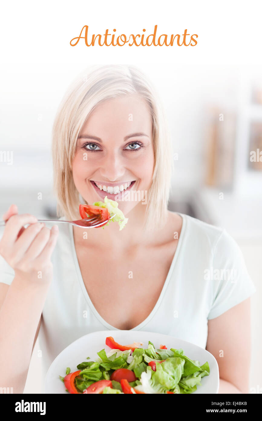 Antioxidants against charming woman eating salad Stock Photo