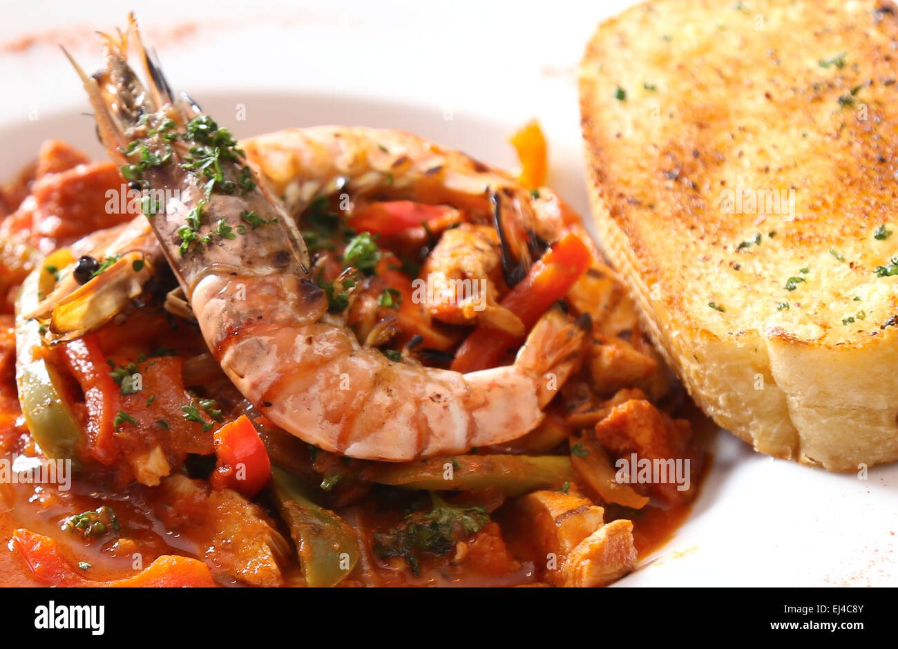 Prawn Curry Dish with Garlic Bread Stock Photo
