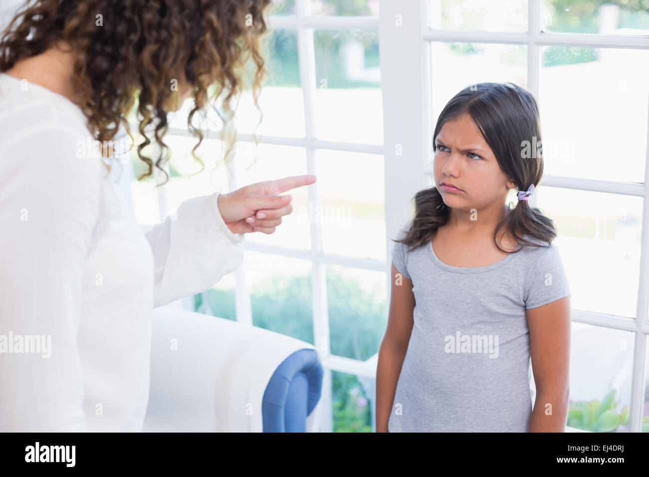 https://c8.alamy.com/comp/EJ4DRJ/angry-little-girl-looking-at-her-mother-EJ4DRJ.jpg