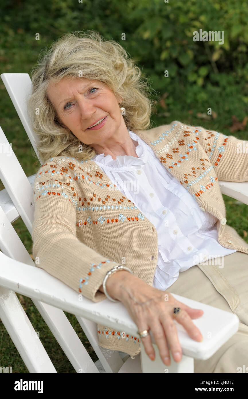Female model sitting on chair hi-res stock photography and images - Alamy
