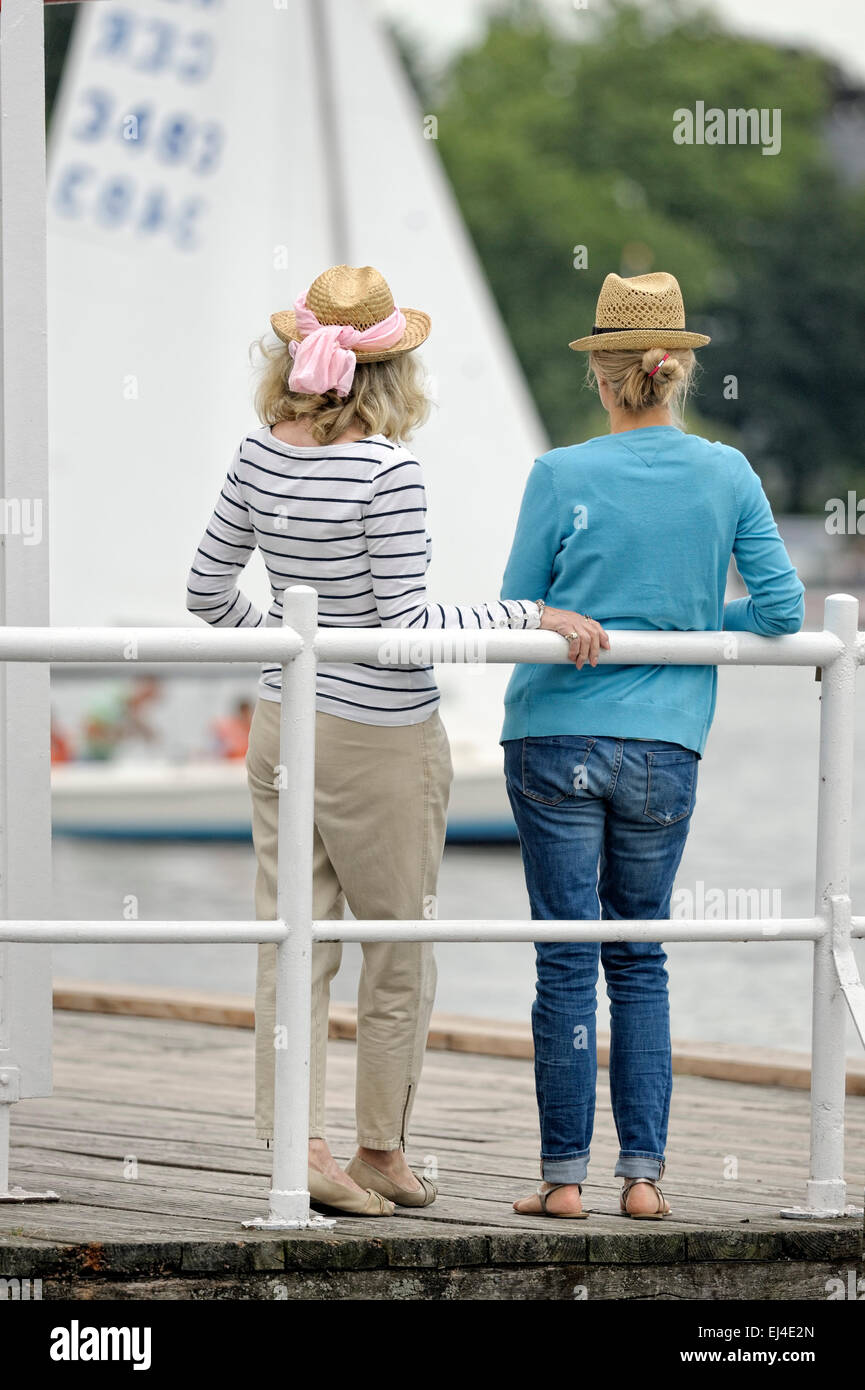 Mother and daughter standing on a landing stage Stock Photo
