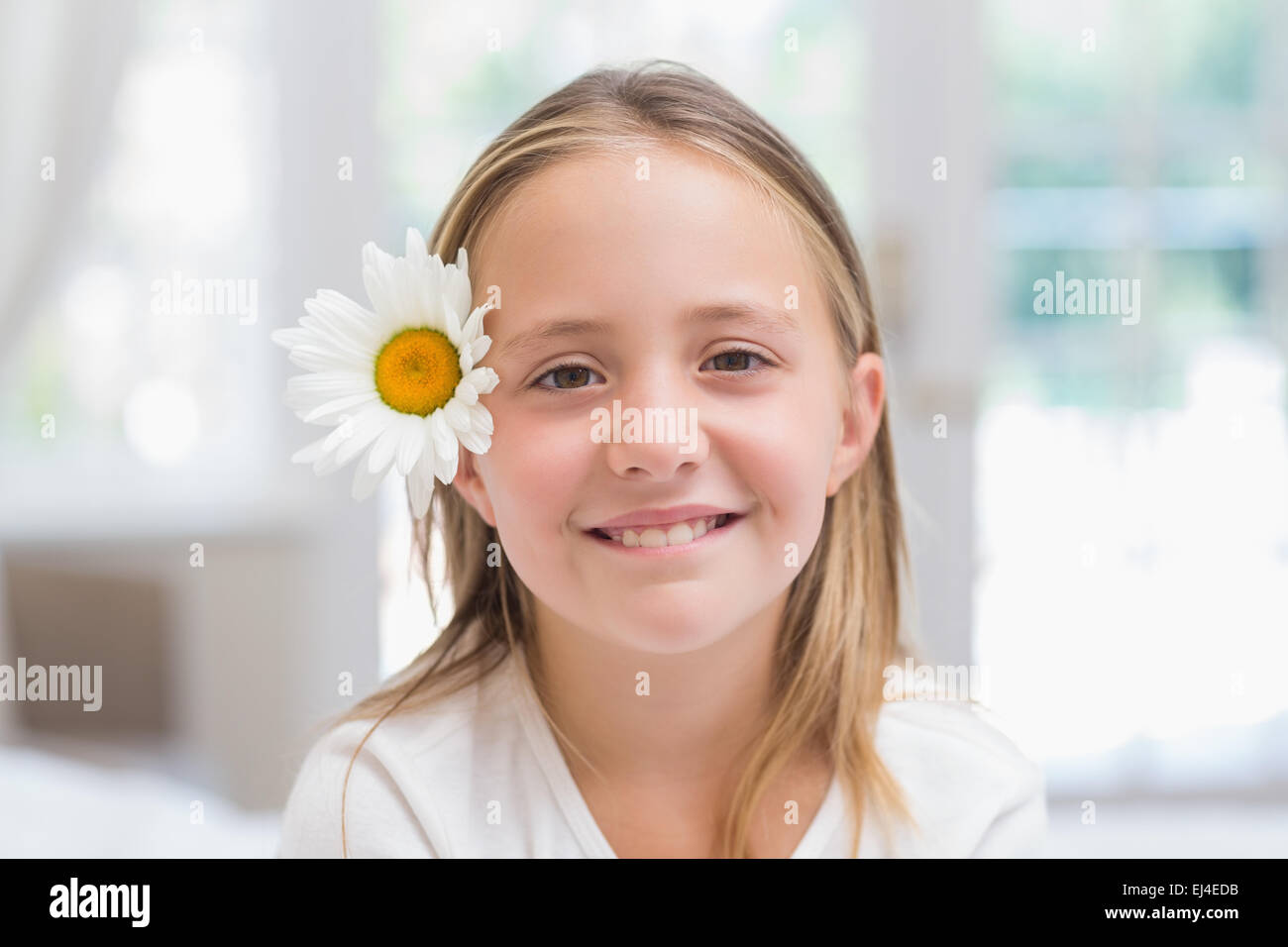 Cute little girl smiling at camera Stock Photo - Alamy