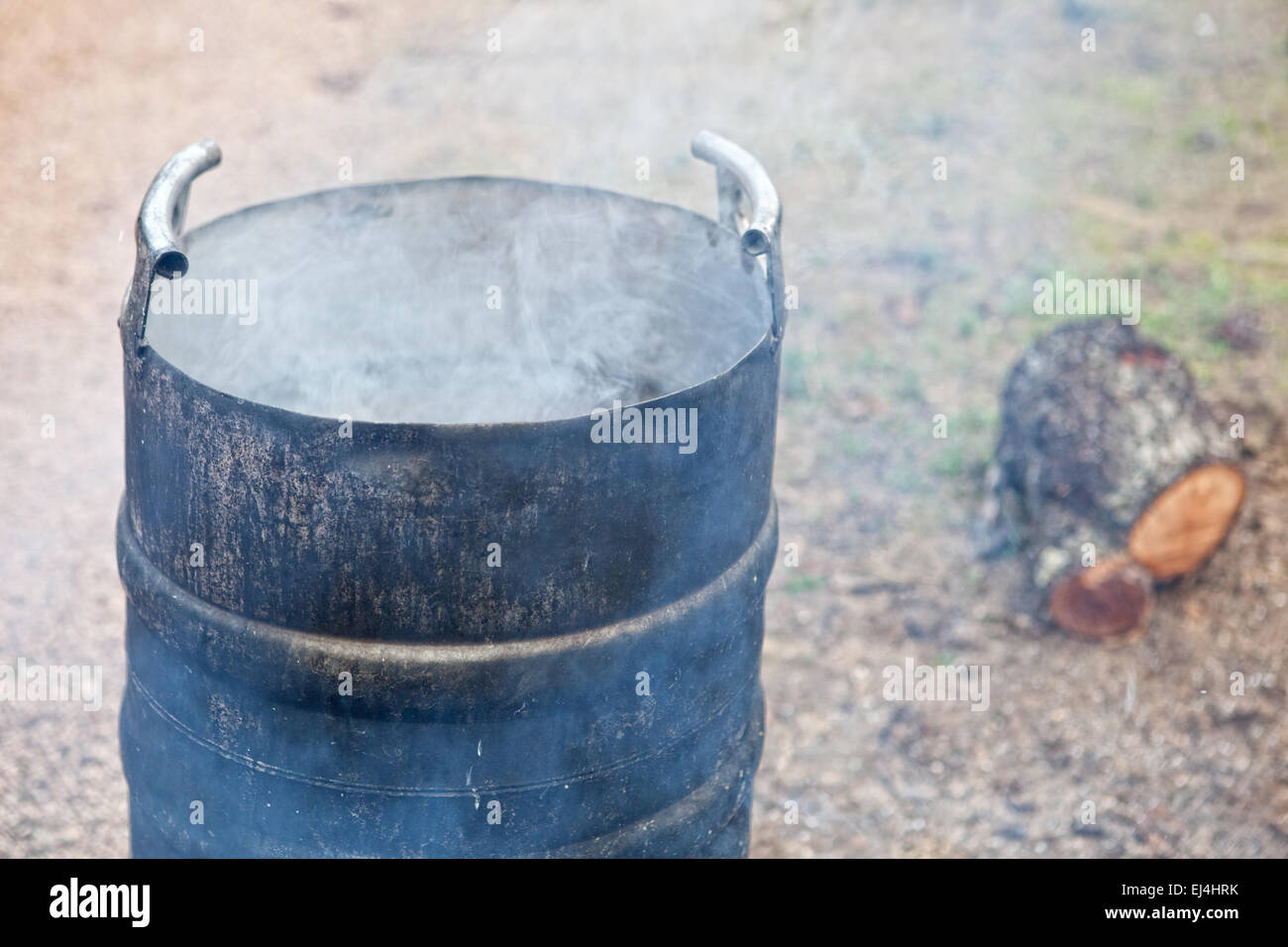 Traditional home slaughtering in a rural area. Smoking scalding pot Stock Photo