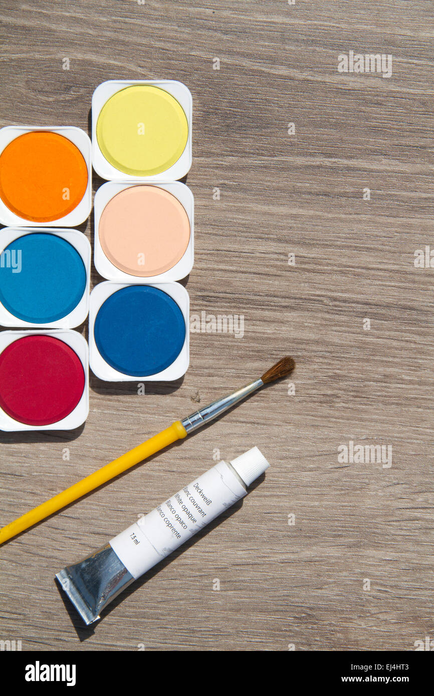 colorful watercolors in wooden background Stock Photo