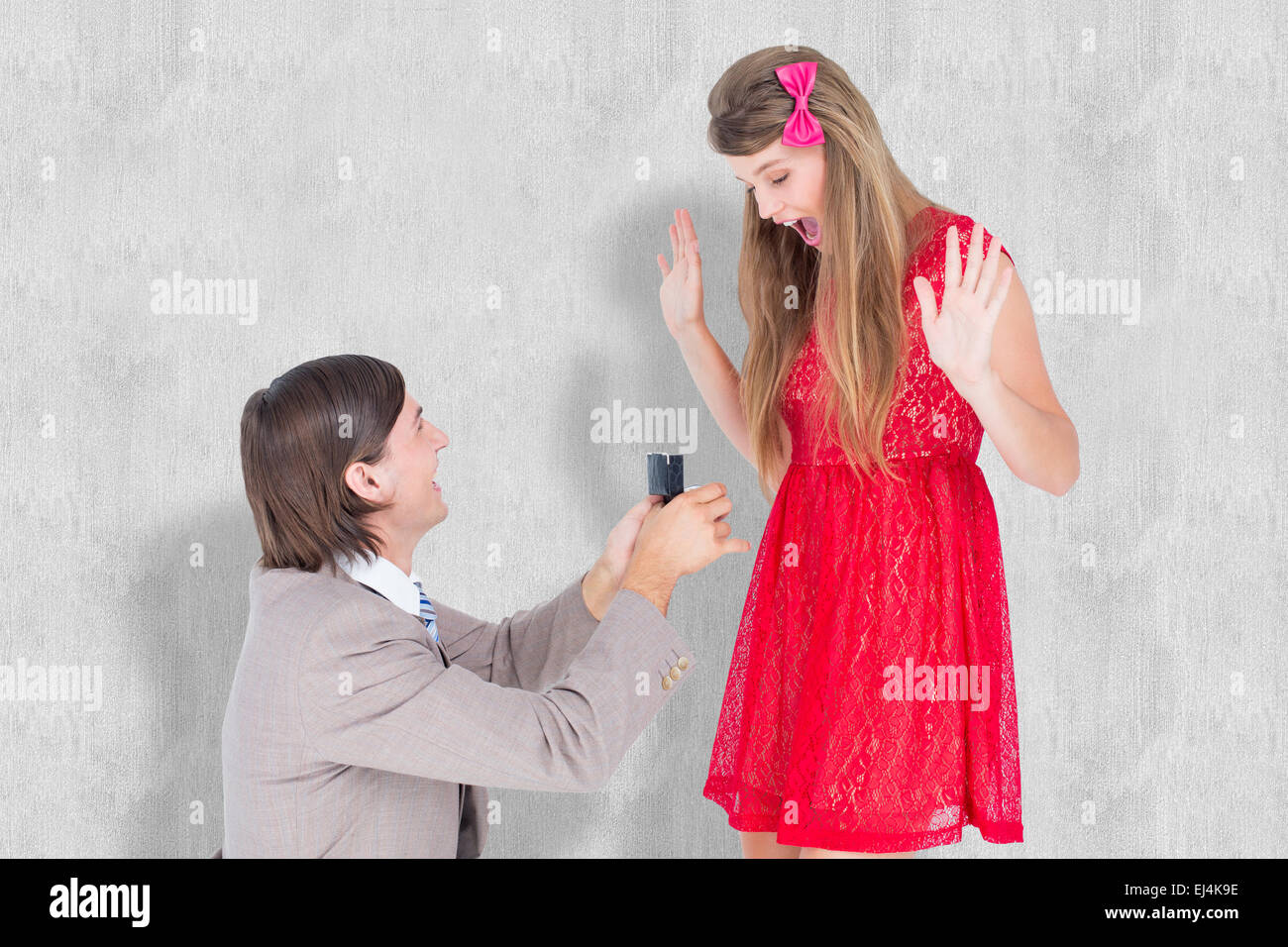 Composite image of hipster on bended knee doing a marriage proposal to his girlfriend Stock Photo