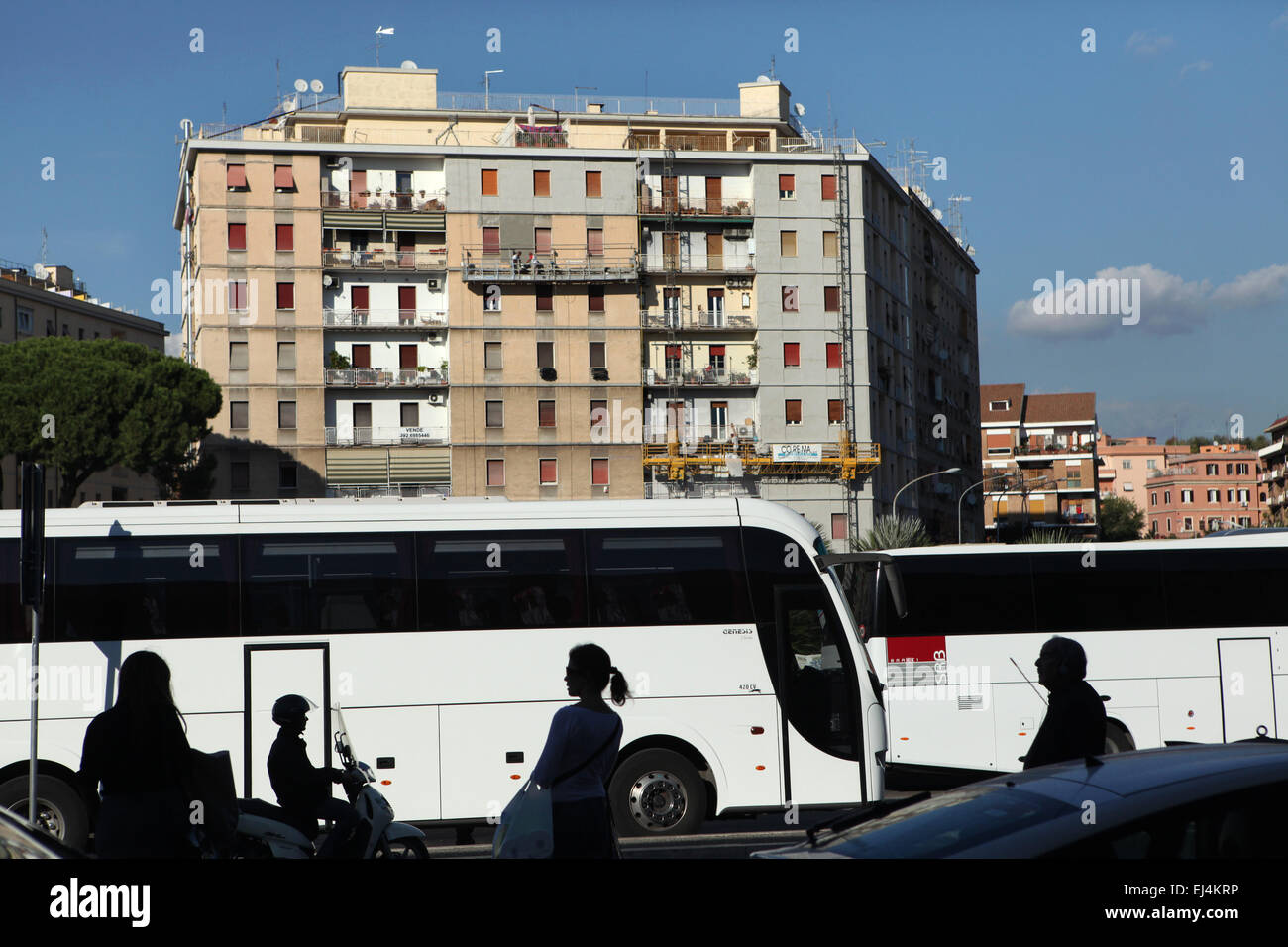 People wait for buses at Piazza dei Partigiani in front of the Roma Ostiense Railway Station in Rome, Italy. Stock Photo