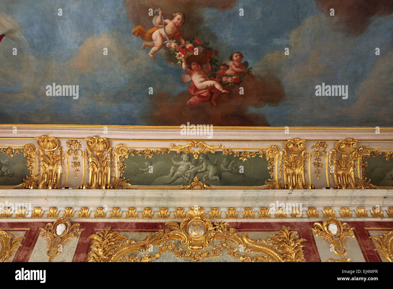Baroque stucco decoration by German sculptor Johann Michael Graff in the Gold Hall of the Rundale Palace, Latvia. The ceiling painting by Francesco Martini and Carlo Zucchi depicts the Apotheosis of the Duke of Courland Ernst Johann von Biron, The monogram JB of Ernst Johann von Biron is seen bellow. Stock Photo