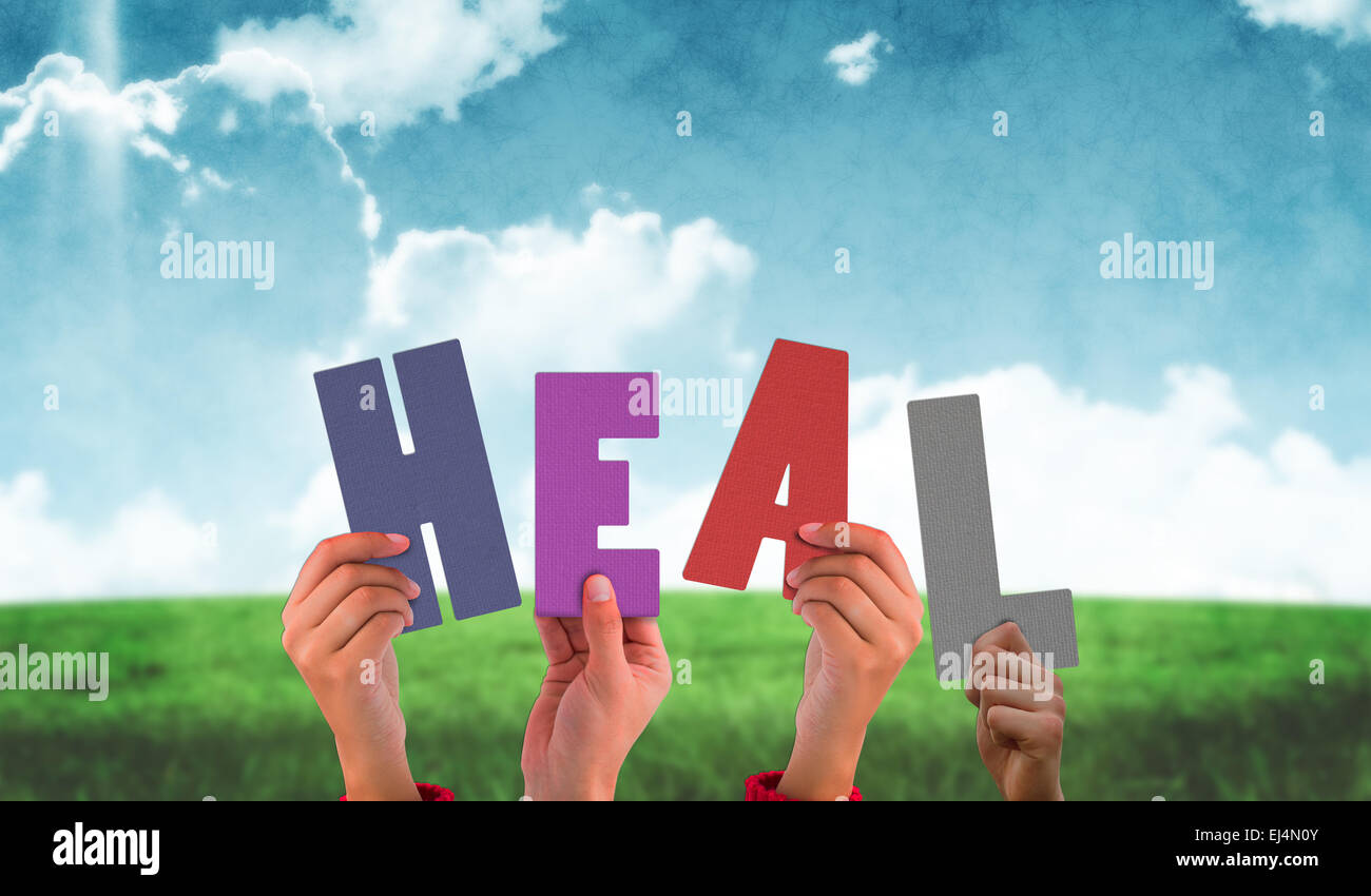 Composite image of hands holding up heal Stock Photo