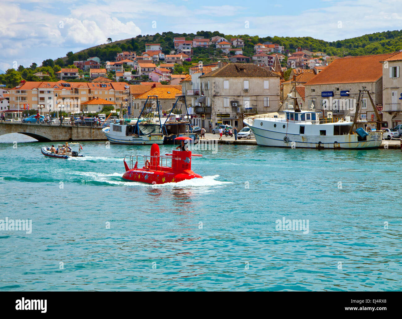 TROGIR, CROATIA, red semi submarine crosses Trogir harbor ready for a touristic tour to explore the underwater worlds Stock Photo