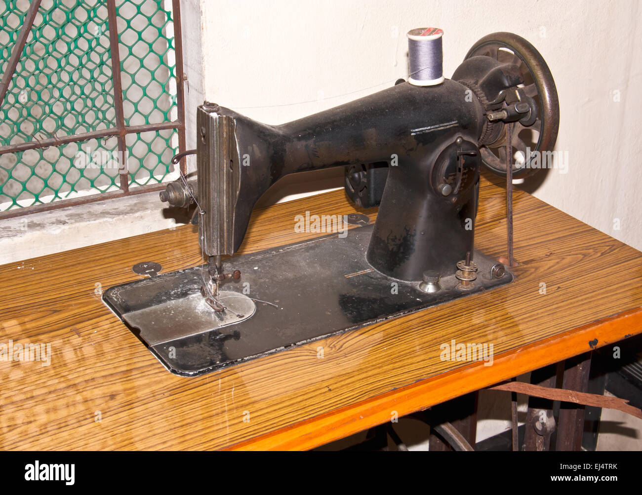 Antique sewing machine. At that very old. Stock Photo