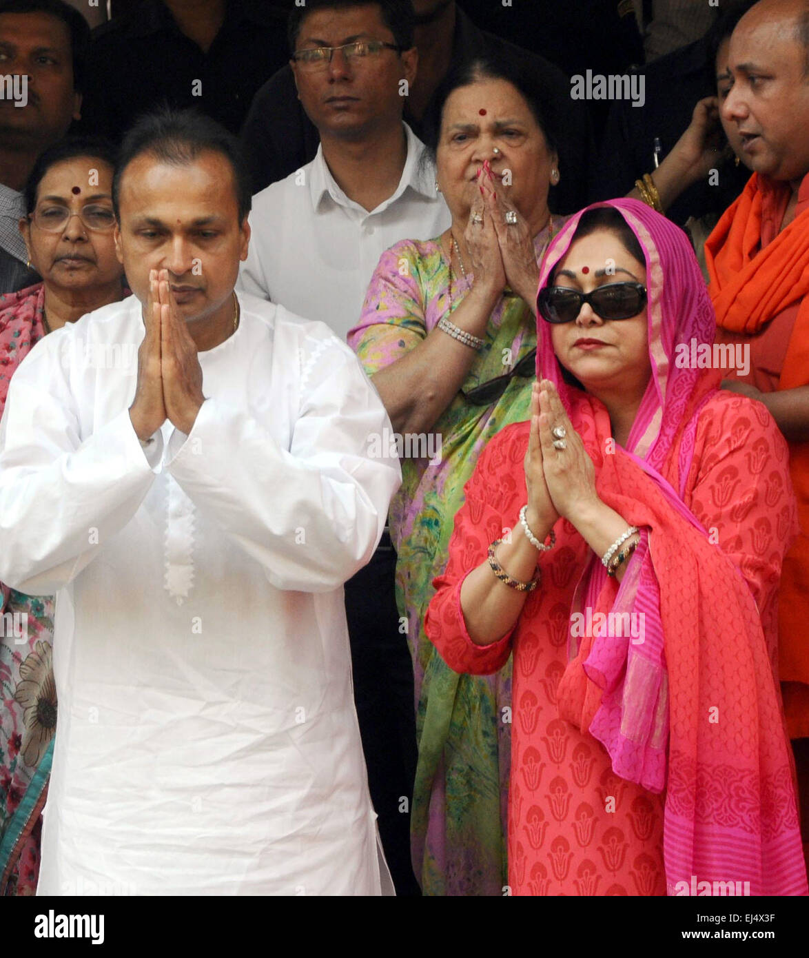 Guwahati, India's northeastern state of Assam. 21st Mar, 2015. Indian business tycoon Anil Dhirubhai Ambani (L, front) and his wife Tina Ambani (R, front) offer prayers at the famous Kamakhya Temple in Guwahati, capital of India's northeastern state of Assam, March 21, 2015. © Stringer/Xinhua/Alamy Live News Stock Photo