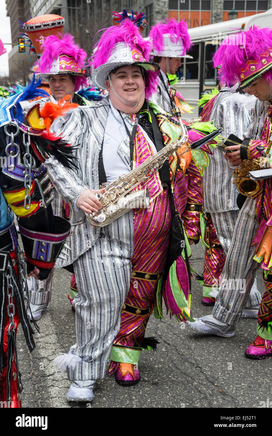 Smiling  string band musician with saxophone, St. Patrick's Day Parade, Philadelphia, USA Stock Photo