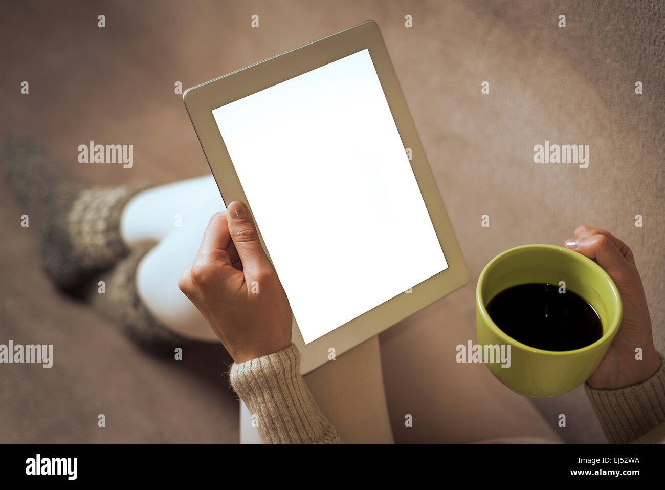 Woman on the sofa with tablet pc Stock Photo - Alamy