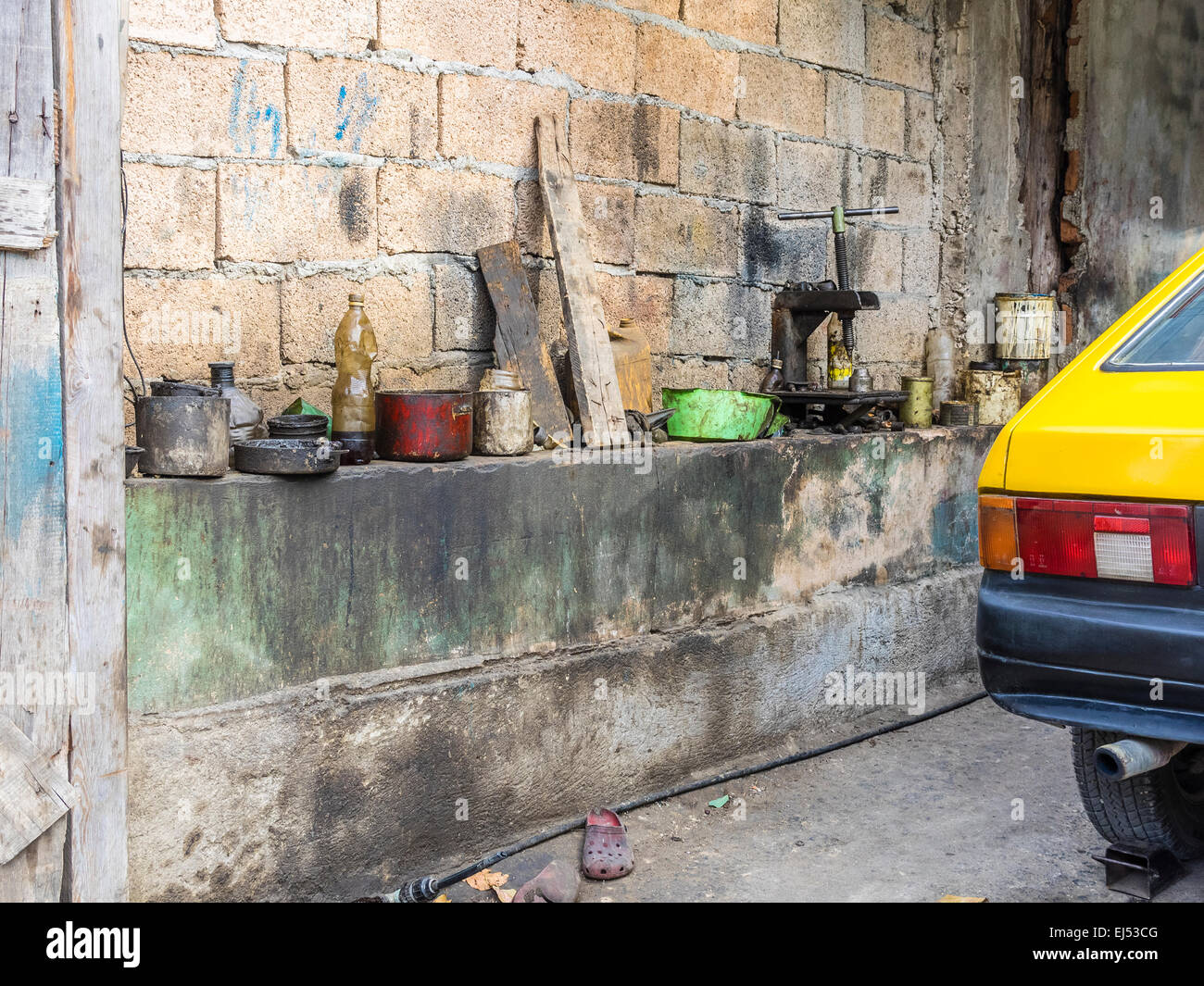 Close-up of part of an automotive repair shop in Santiago de Cuba. Stock Photo