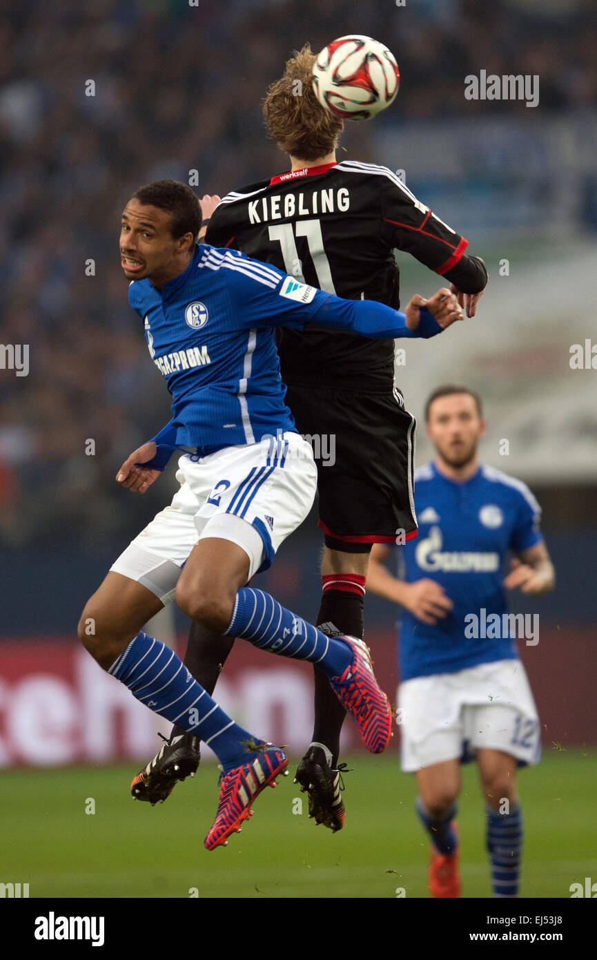 Gelsenkirchen, Germany. 21st Mar, 2015. Schalke's Joel Matip (L) and Leverkusen's Stefan Kiessling fight for the ball during the German Bundesliga soccer match between FC Schalke 04 and Bayer Leverkusen at Veltins-Arena in Gelsenkirchen, Germany, 21 March 2015. PHOTO: MAJA HITIJ/dpa (EMBARGO CONDITIONS - ATTENTION: Due to the accreditation guidelines, the DFL only permits the publication and utilisation of up to 15 pictures per match on the internet and in online media during the match.) © dpa/Alamy Live News Stock Photo