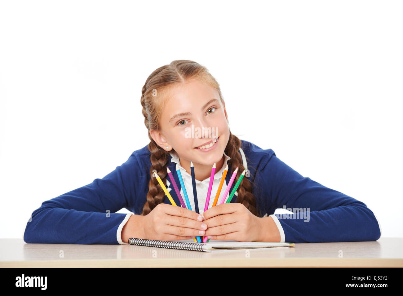 Smiling school girl with colorful pencils Stock Photo - Alamy