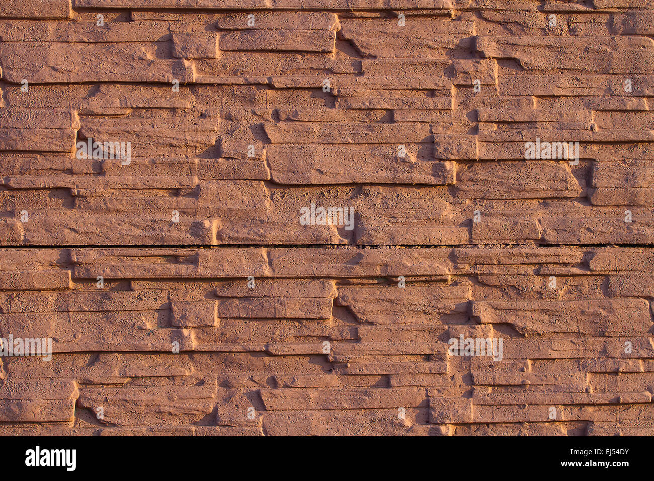 Background of colored stone wall  pattern texture Stock Photo